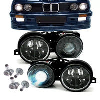 Fari neri con mirino + lente DE ottica Hella + lampadine H1 per BMW E30